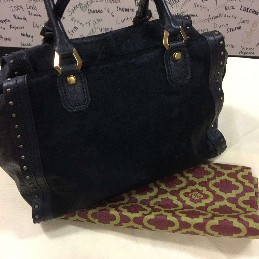 Black leather and calf hair handbag by orYANY